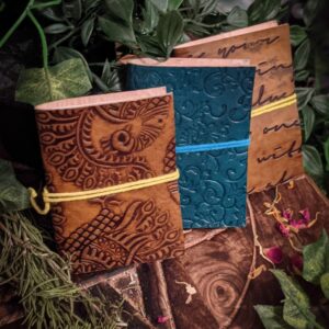 Beauituful Hand-made Journal with Leather Cover, closed with string loop. Assorted colours and patterns.