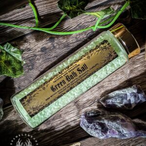 Green Salt is known within European traditions for bringing in abundance and growth. It connects to the element of earth, and so is also used for stability, grounding and healing. The 'Green' in the green salt originally comes from the herbs, flowers and dyes colouring the salt green- however it's the spirits of the plants we believe that works the magic. With the bath friendly version we've chosen essential oils that function in the same way, letting you tap into the same energies as the Green Salt. We've made sure it's as skin safe as possible! The main essential oil in our Green Bath Salt is Vetiver Vetiver is a plant of stable roots- it's roots grow deep and matted. It's so good as its job it's now used as a plant to help stop erosion. It's a prolific plant, able to clone itself, and has been used to heal for millennia. The parts of vetiver used in this blend are the roots, the parts of the plant that are known for their abundance! The supporting essential oils strengthen the vetiver spirits to finish off the blend! How to Use To use this bath salt, simply sprinkle some in your hot bath and soak up all of the oils and let the plant spirits work on you and with you. For a more immersive spiritual experience, meditate while sitting in the water, and connect in to the plant spirits- tell them what you wish to work on so that you can work together. Our Bath Salts are our skin friendly version of our salts range. Some of our witchcraft salts contain things that are probably best not put in the bath- but these bath salts are crafted for the same purposes are our coloured salts, but made with just skin safe ingredients. Lastly, to see how people use these in action, visit our Instagram Page. If you want to learn more about our products, go to our ‘Learn More’ Page. The essential oils used are: Vetiver, Citrus bergamia, Pelargonium graveolens. Full ingredients in image. These Bath Salts come in a 100ml clear glass tube with a metal cap.  Approximately 115g- enough for two to three baths.