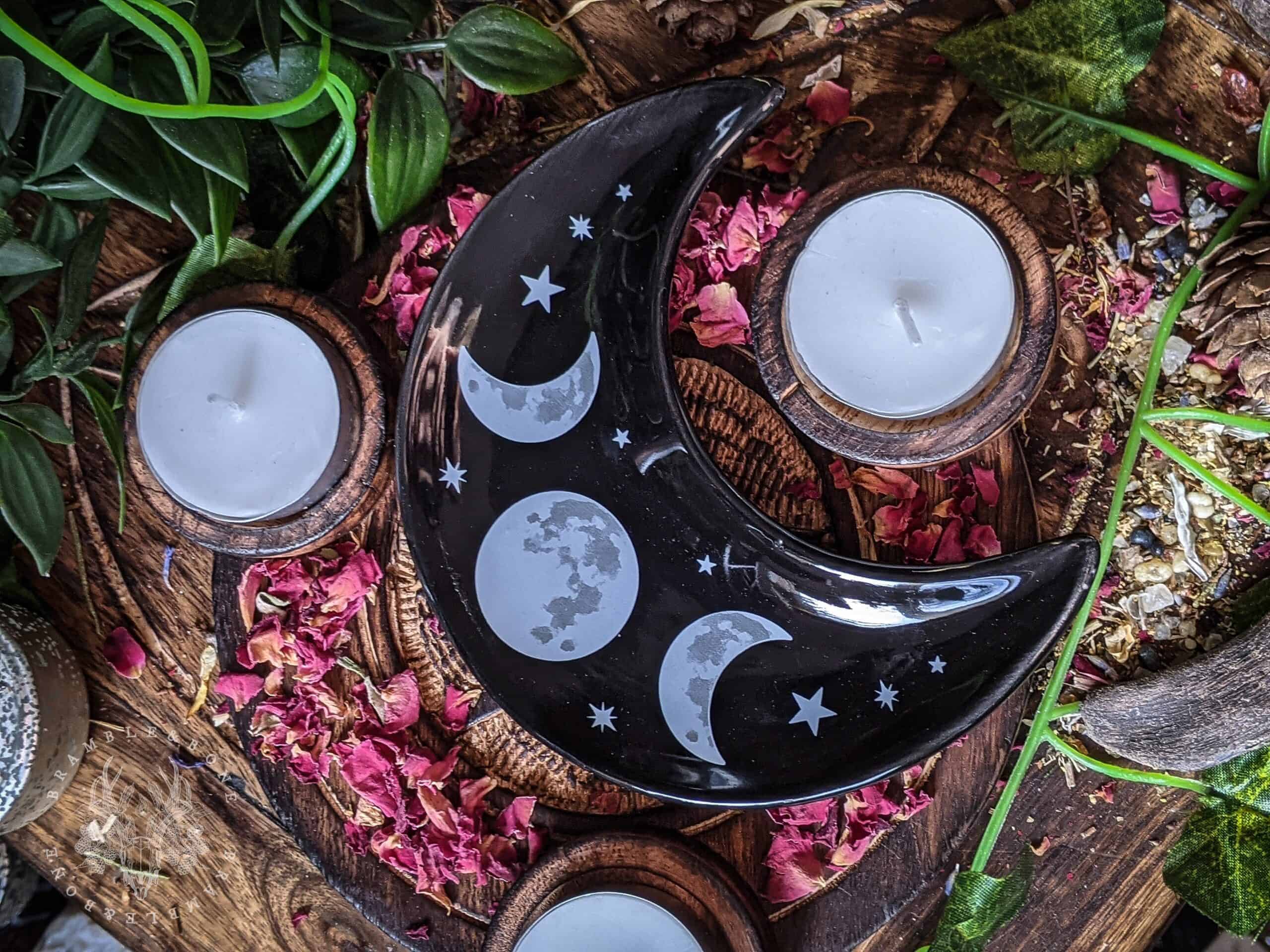 This small moon phase candle plate is a perfect addition to any altar or shrine! A perfect size for chime candles, tealights, as well as crystals, cleansing salts and offerings. This candle plate is an excellent accompaniment for any witchcraft or devotional working. Of course, with it's moon phase print, you may wish to reserve it for more lunar magic more than other types of witchcraft. Ways of Working There's plenty of room for a main candle on this plate, as well as offering and petitions for any spirit working you may wish to do. This could become in essence a moveable shrine within itself. Simply light a candle and then place any other offerings you wish upon the plate. With the Lunar print, you may wish to reserve this plate for lunar workings- anything done to honour or work with the moon. This could be a wonderful dish to use to lay out your crystals and other objects under the full moon. Whatever you wish to be blessed or infused in moonlight, place it on this dish and then leave it under the moon's rays. Because of it's size, this can also be a wonderful cleansing dish. Simply fill it with salts, or cleansing herbs of your choice and then lay on any objects on top that you wish to be cleansed. And of course, this is the perfect size dish for 'grab and go' crystals. Place your favourite crystals in this dish on your altar for easy access.