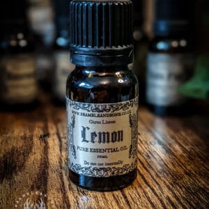 Latin Name: Citrus Limon Part Of Plant Used: Fruit Peel Magical Affiliations: Cleansing, Cursing, Prosperity, Lunar, Diana, Purifying, Love, Protection, Mirror Work, Focus, Sharpens, Essential Oils in alchemy and magic were often seen to be the fiery, emotional, desireful soul of the plant. The different parts of the plant are attuned to different elements and their place in the universal cosmology, which is why things such as floral waters, dried plants and ashes are often also used depending on their magical properties. This belief is seen within Hermeticism, Spagyrics, Alchemy and Folk Magic. Essential oils are extracted from various plant parts like flowers, leaves, stems, roots, seeds, bark, resin or fruit rinds. Each plant contains only a tiny percentage of essential oil, so several kilograms of the plant are harvested to extract a few millilitres of oil. Therefore, these oils are highly concentrated and usually dispensed in drops, or mixed with a base oil for massages.