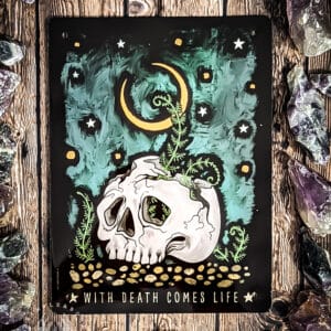 Death is not always the end- It can be a new beginning. Featuring the unfurling of a plant from within a skull, it shows that death can also lead to the birth of new life. This happens with both physical death and spiritual death. Sometimes things in our lives need to die to let other parts of ourselves thrive and breathe. This is a process many witches and pagans with a connection to gods of death meditate upon. With a stunning art style, it’s just what’s needed to add a little magical aesthetic to your space.